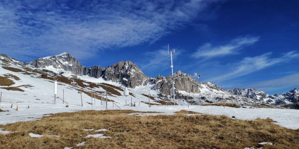Weather station in alpine summer landscape