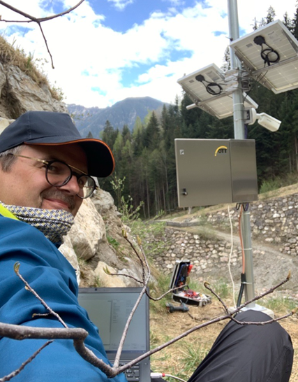 environmental monitoring station with camera and technician